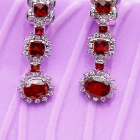 Guy on a bike ok a wooden bridge with a forest backdrop